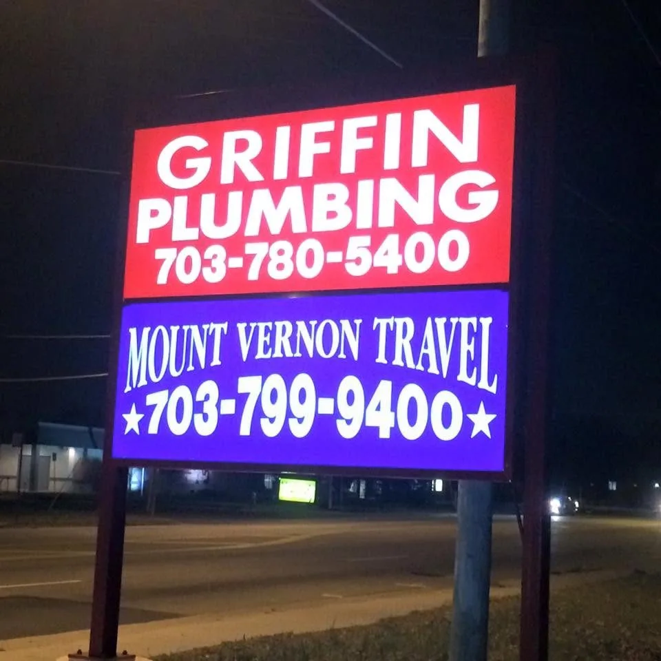 Illuminated pylon sign lit at night — Griffin Plumbing