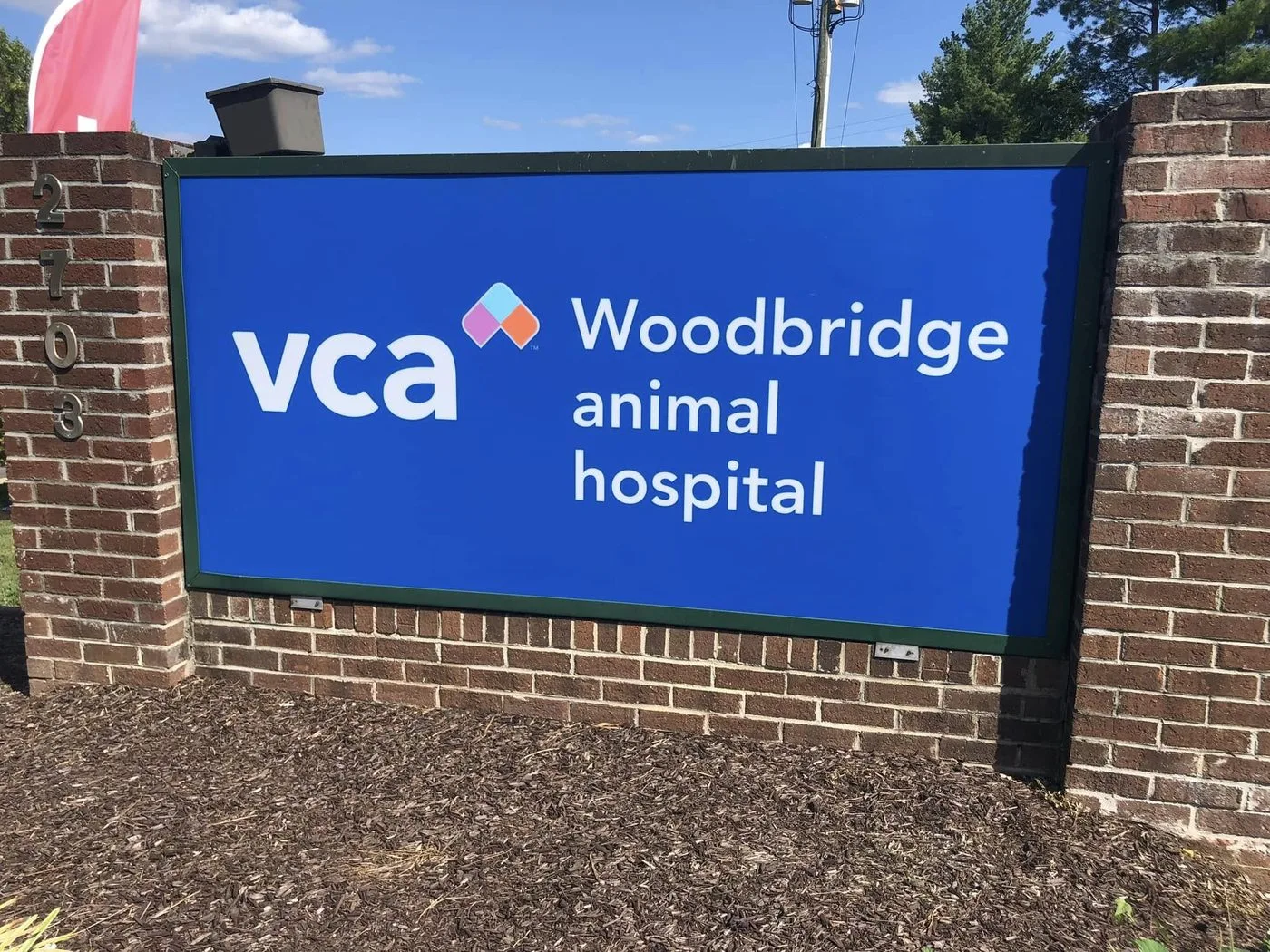 Wall-mounted sign — VCA Woodbridge Animal Hospital