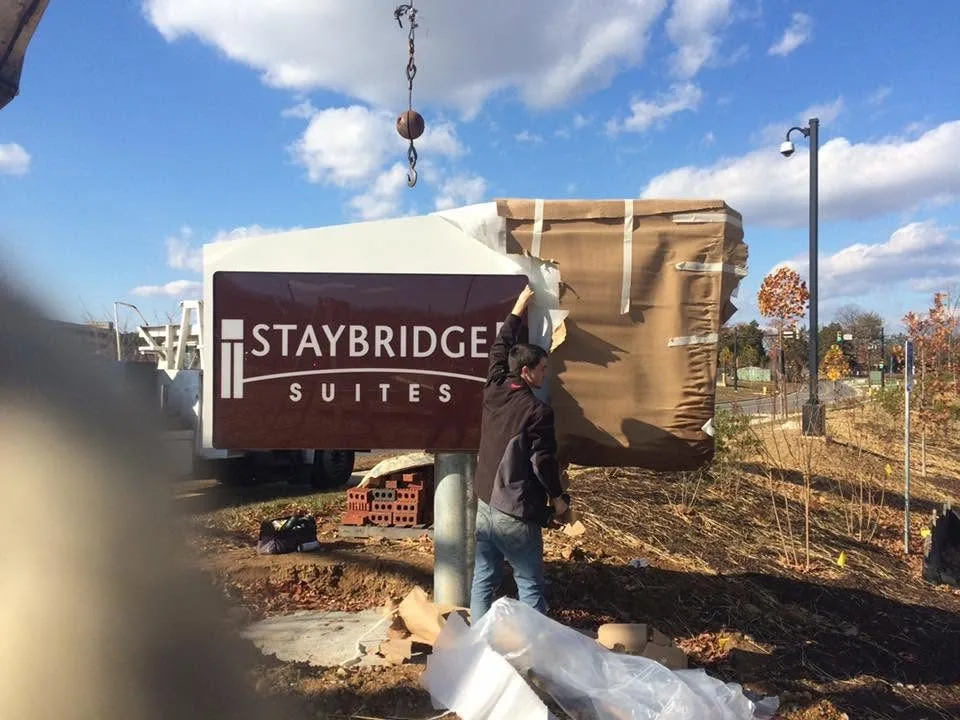 Crane sign installation — Staybridge Suites