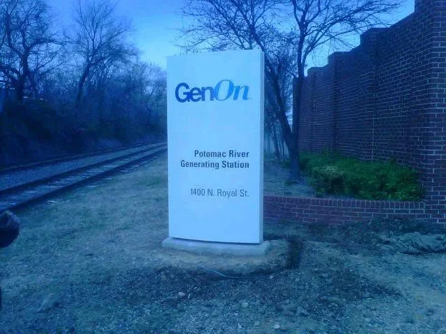 Illuminated monument sign at night