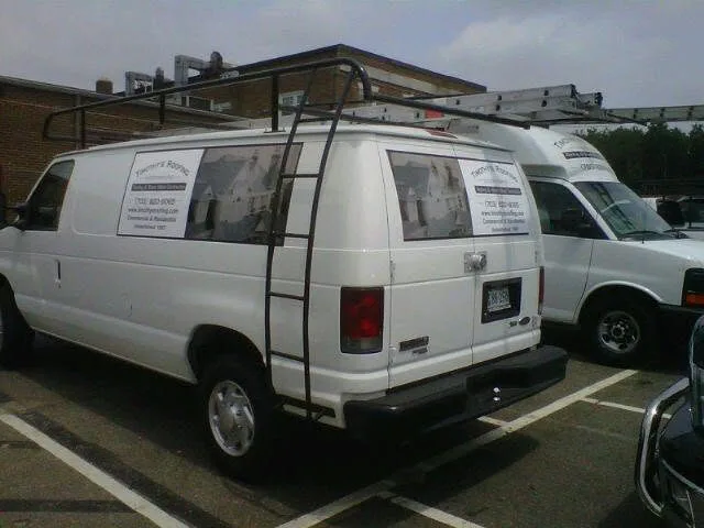 Company vehicle with lettering and graphics